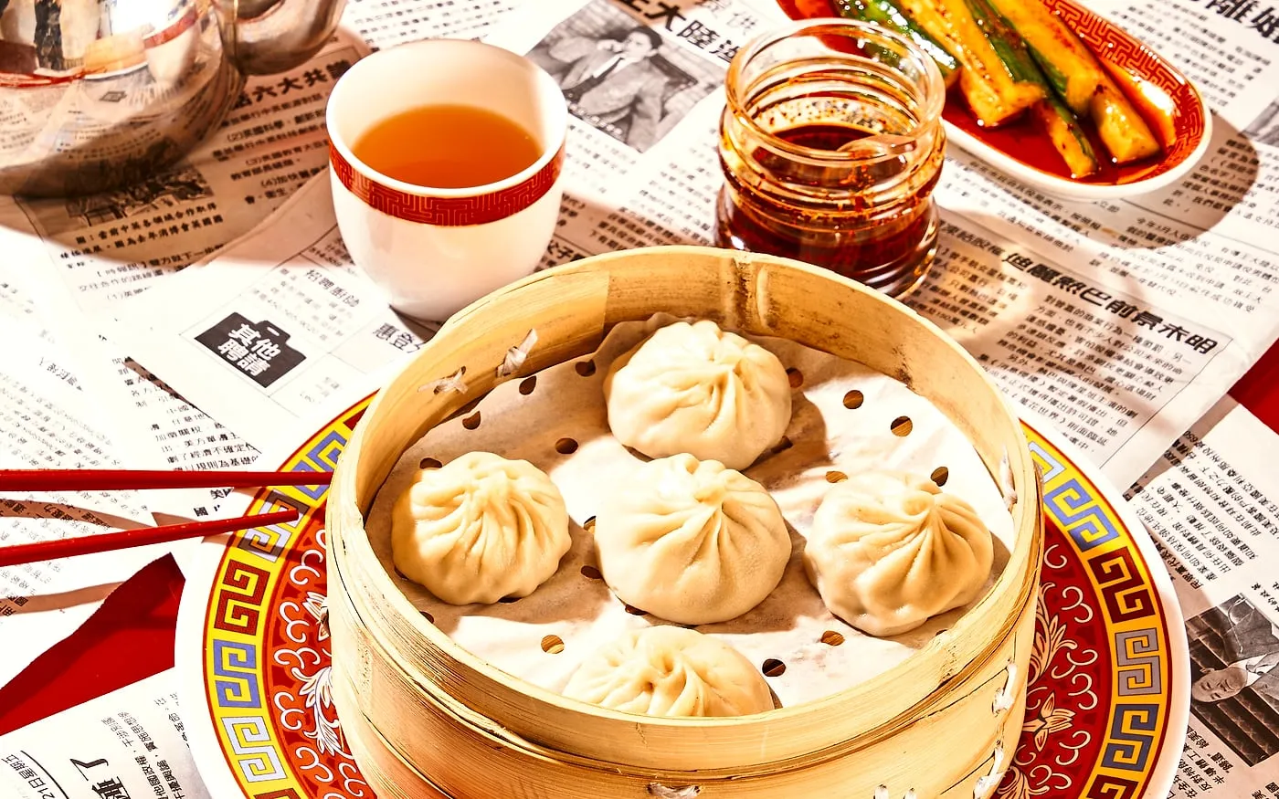 Sammi and Soupe Dumpling table with soup dumplings, dipping sauce, and casual shared plates