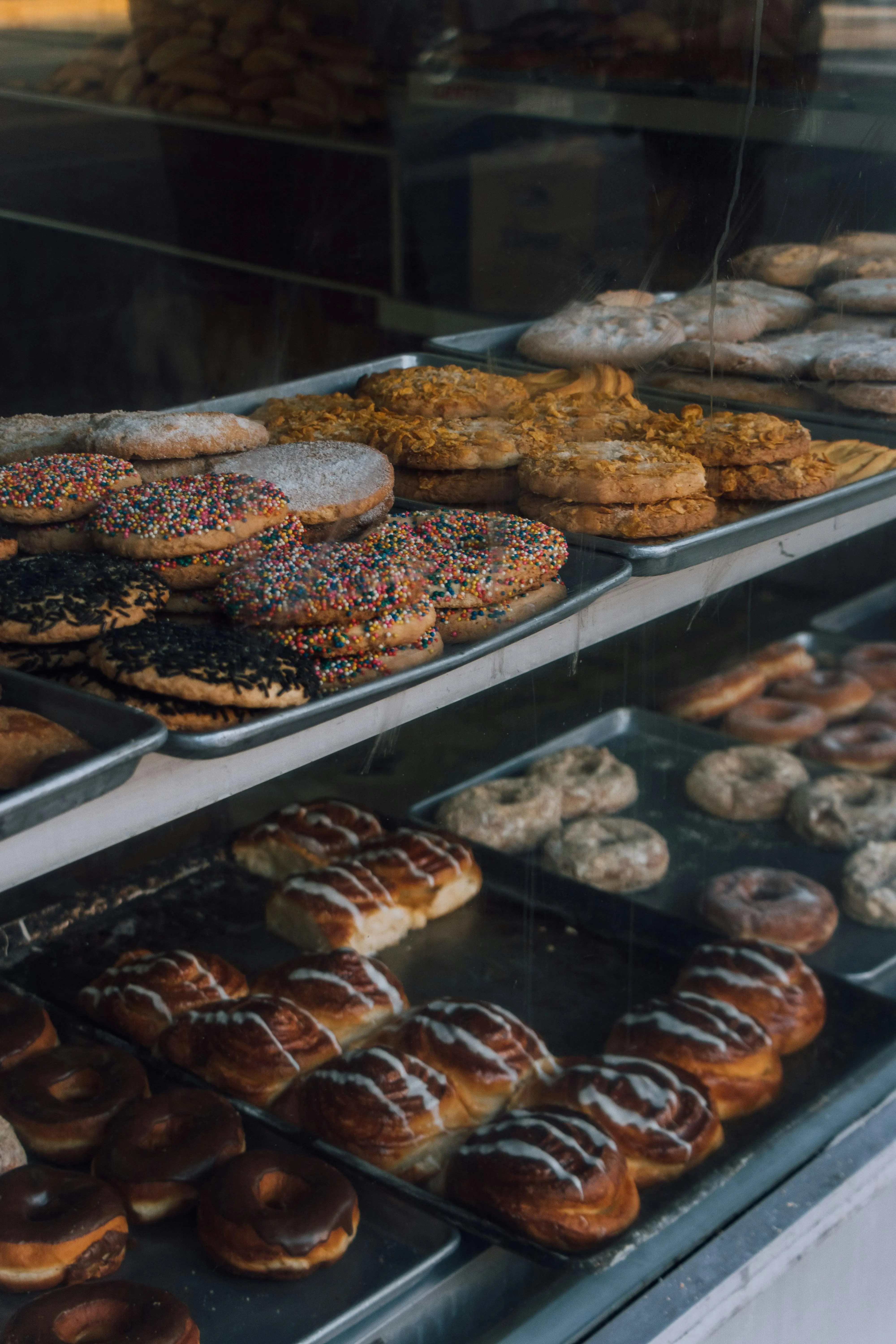 Mediterranean bakery counter with flatbreads, pastries, and takeaway lunch items