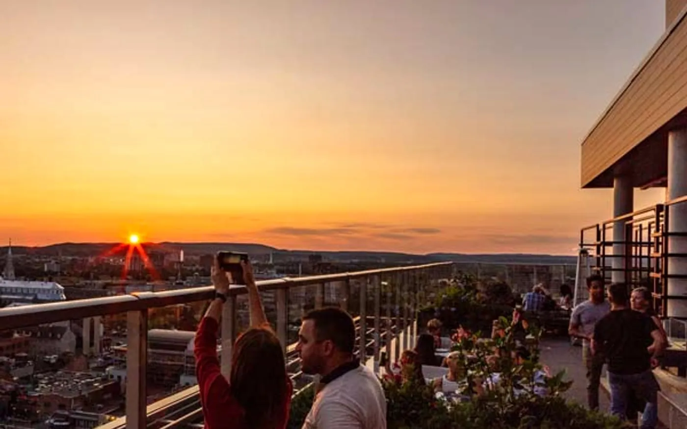 Copper Spirits and Sights rooftop at sunset with Ottawa skyline views for rooftop bar questions