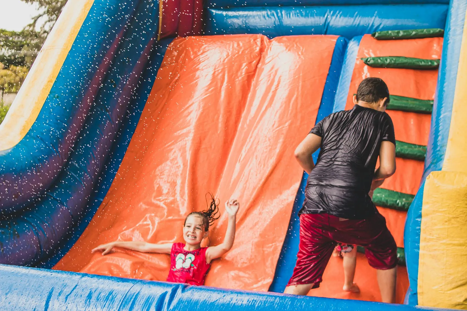 Child playing inside a bouncy castle