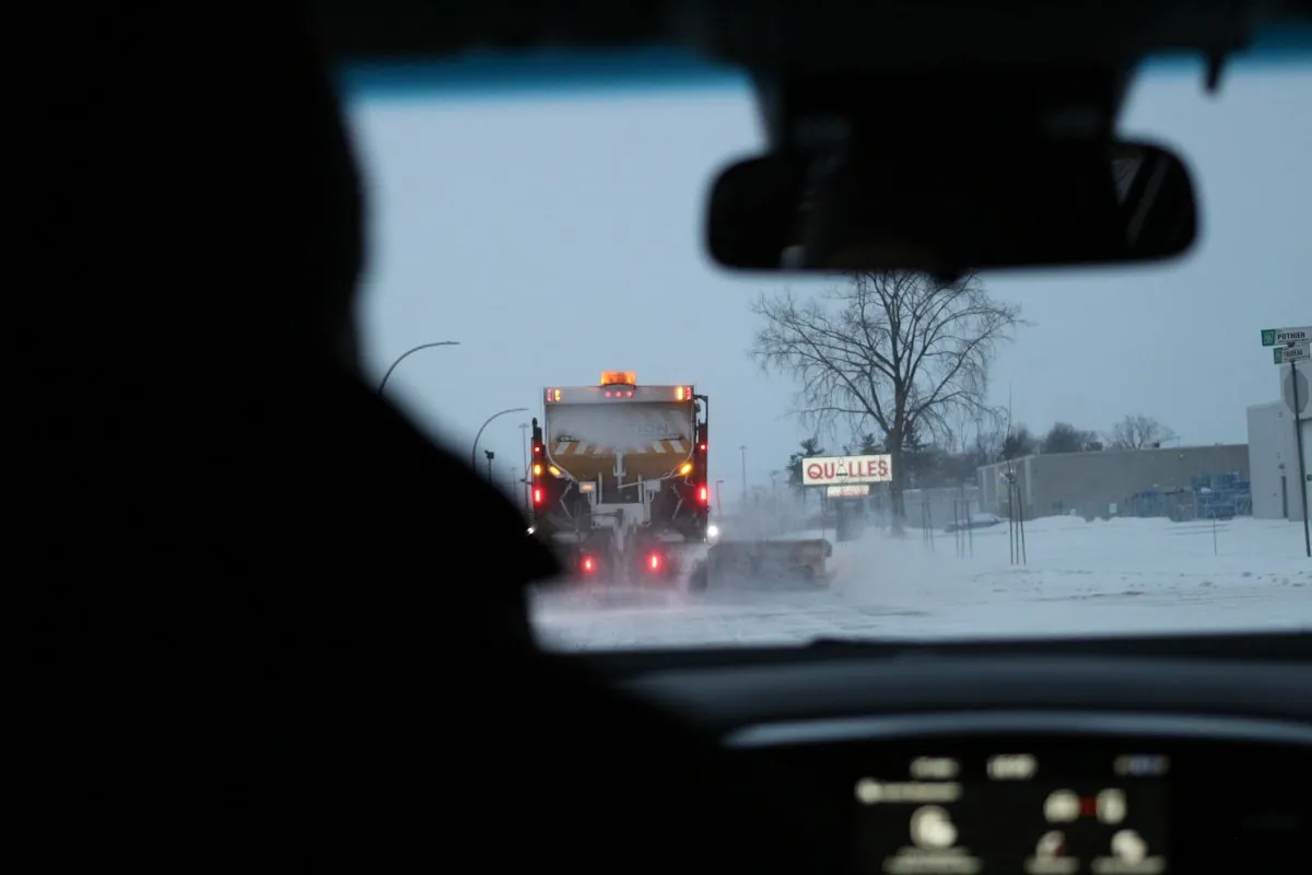 Icy Ottawa roads with reduced visibility during freezing rain