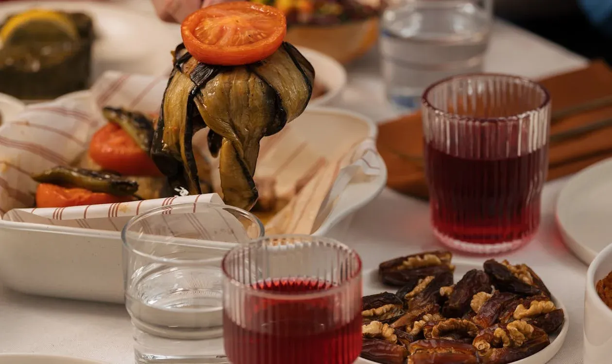 Mediterranean dinner ending with shared plates, drinks, and a warm restaurant-table atmosphere