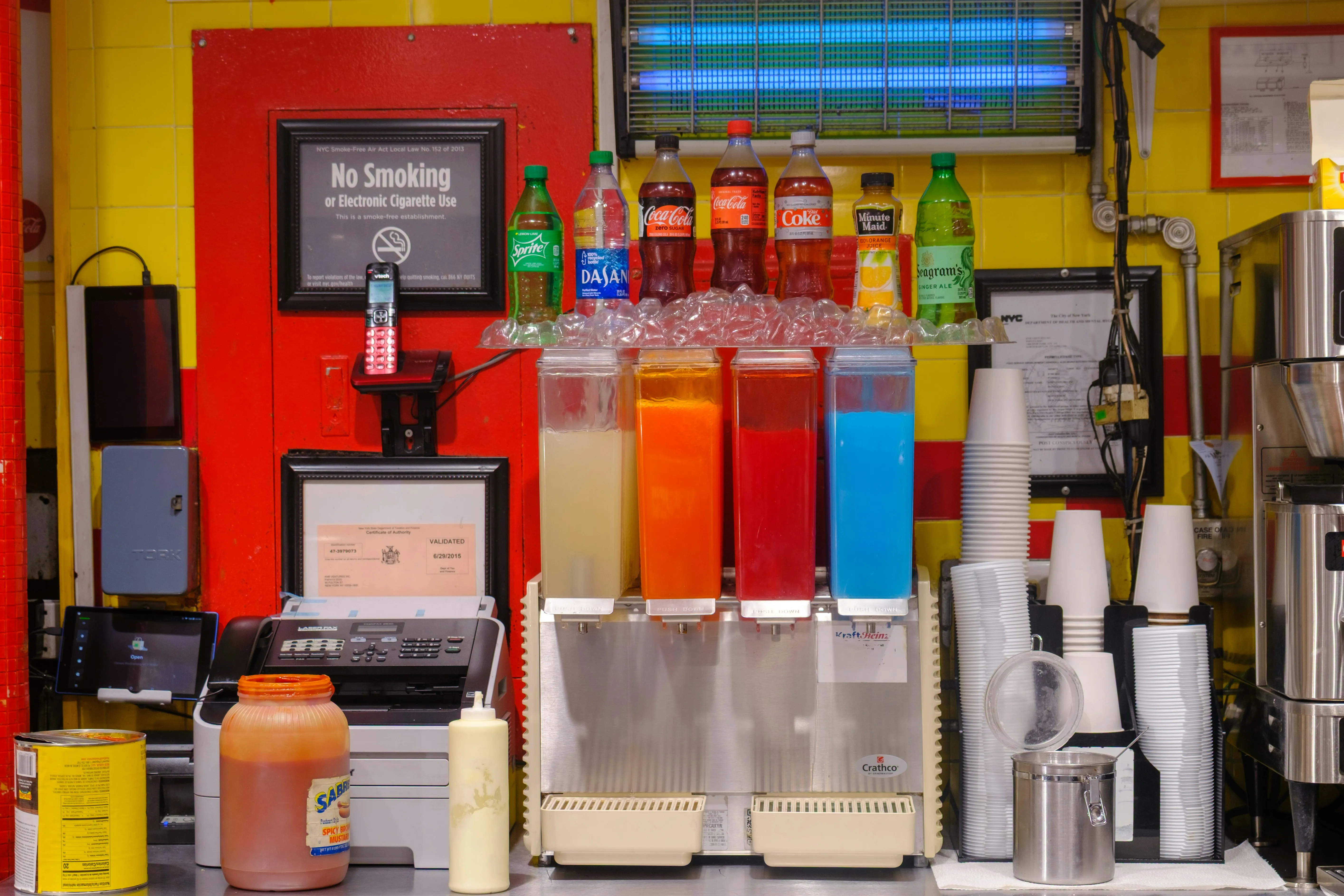 Fast food restaurant garnish bar with colourful toppings and sauces