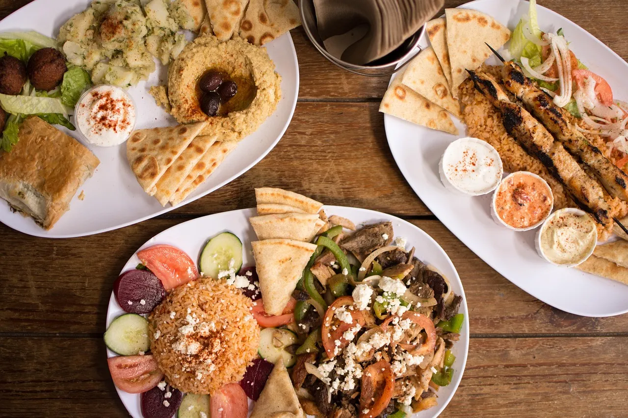 Authentic Greek mezes plate with hummus, falafel, souvlaki and Greek rice