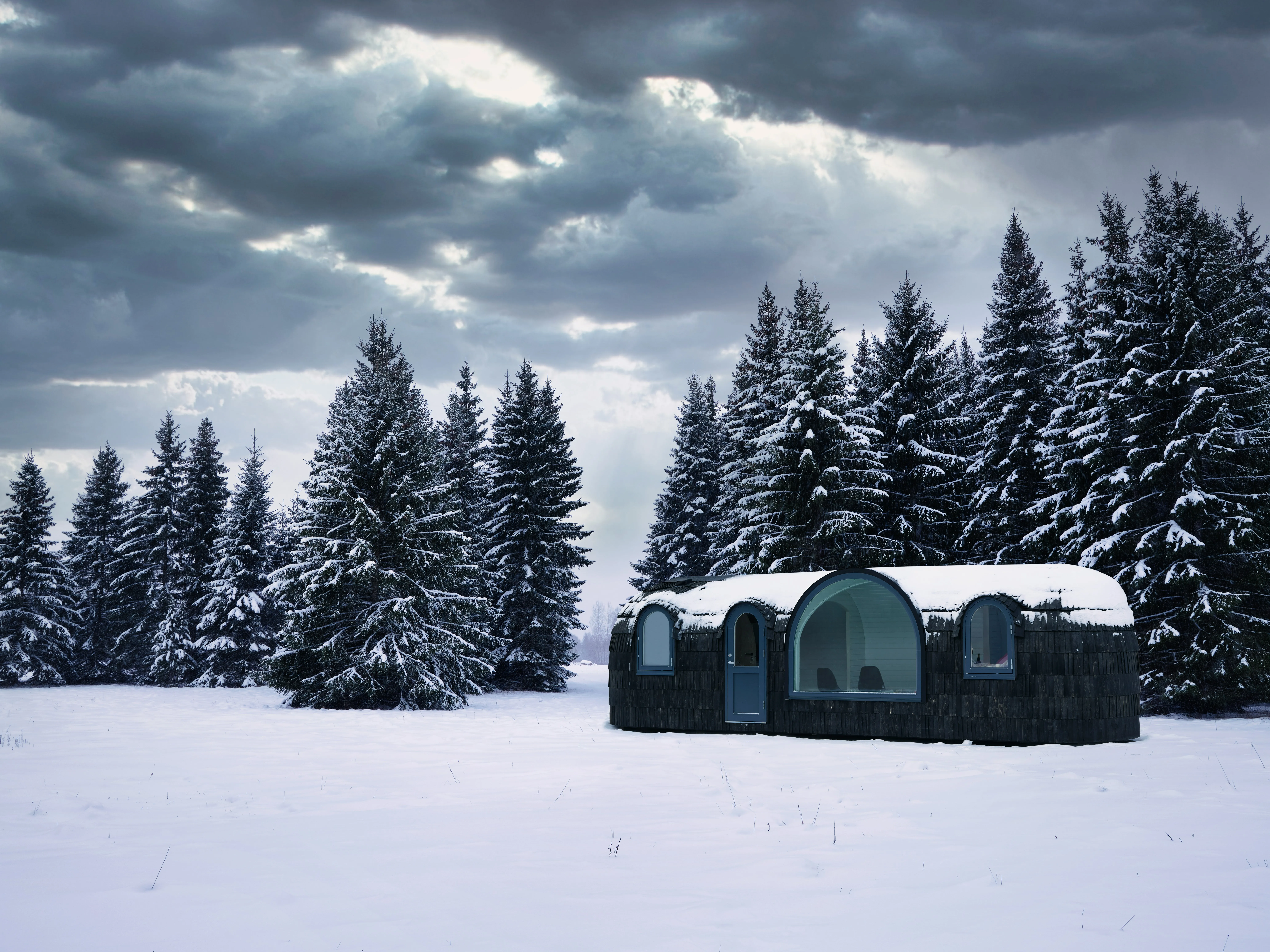 Dining domes in snow at night