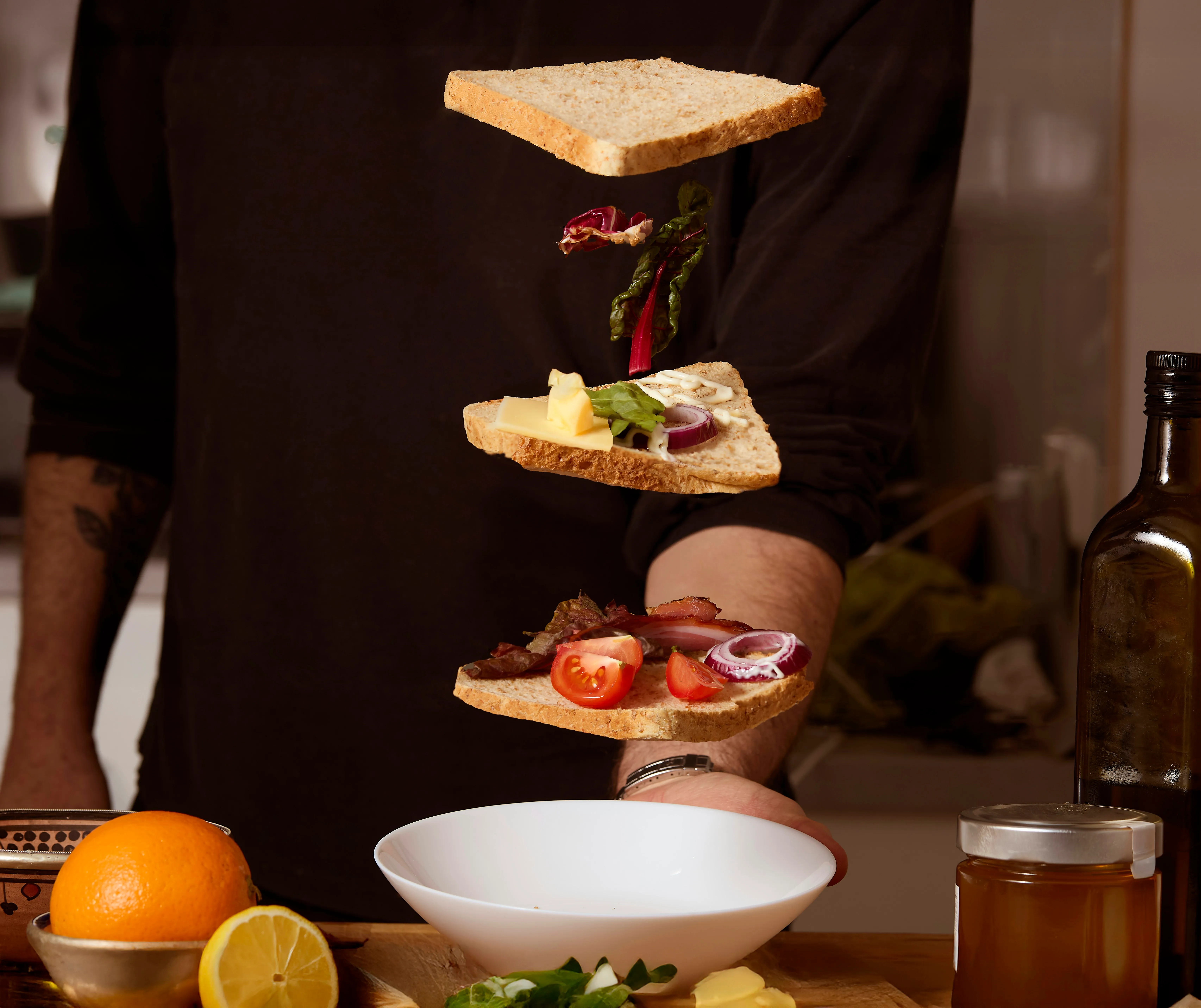 Elegant three-tiered afternoon tea service with scones and finger sandwiches