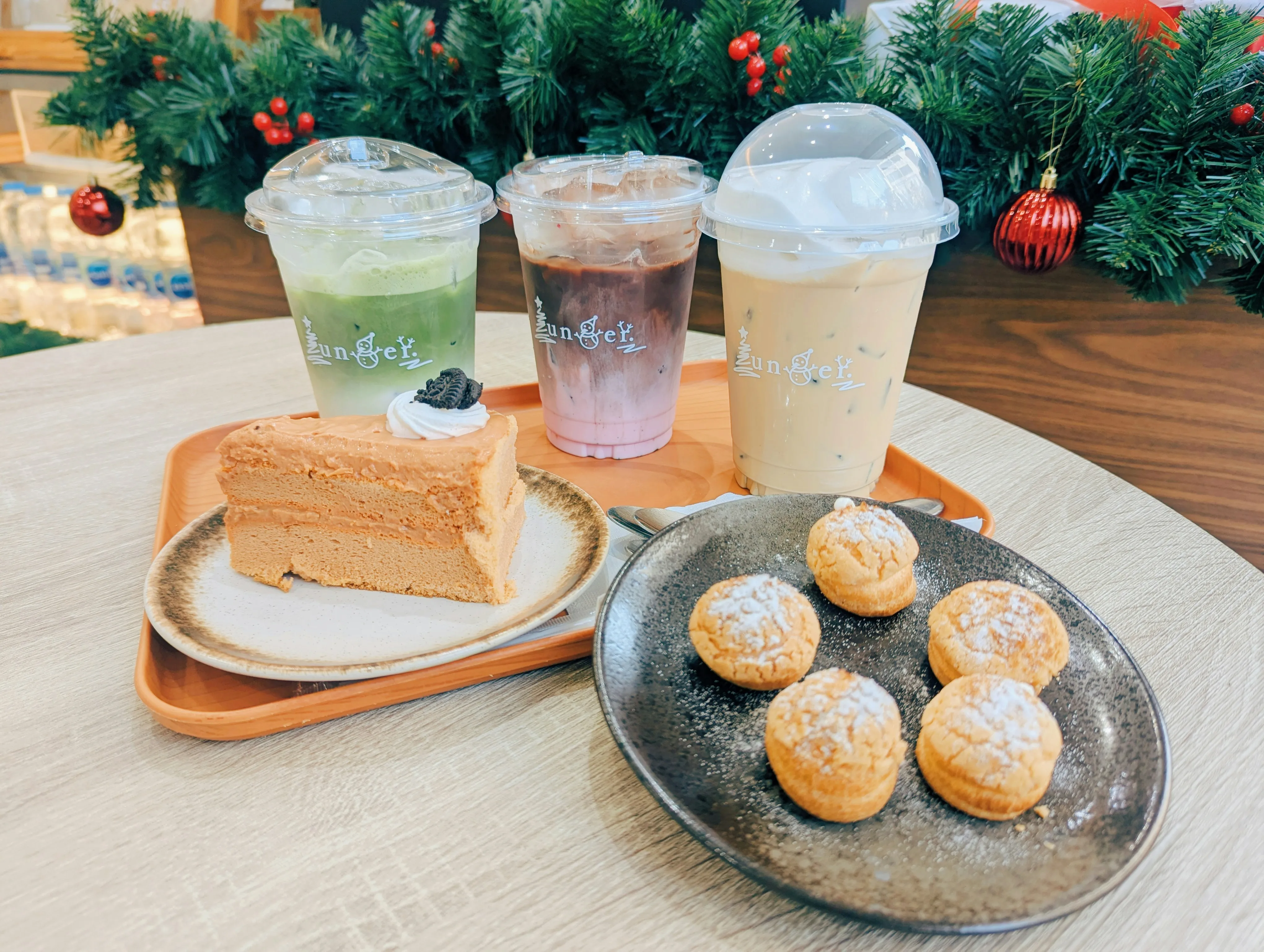 Holiday-themed afternoon tea service with festive decorations