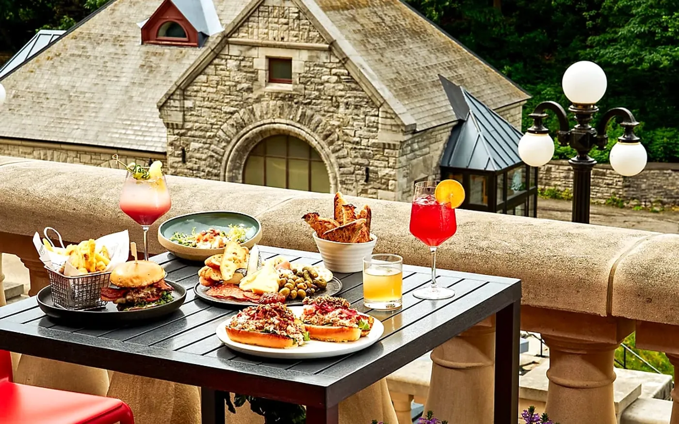 Fairmont La Terrasse table with drinks and Château Laurier stonework beside the Ottawa landmark view