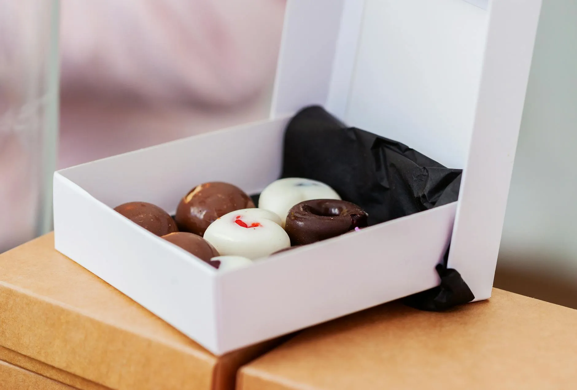 Colourful donuts in a display case