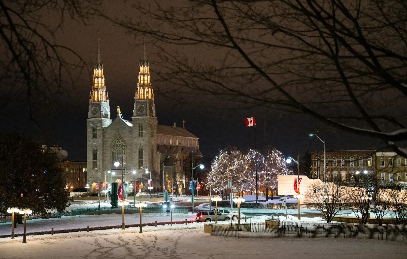 Parliament Hill lit up at night in winter.