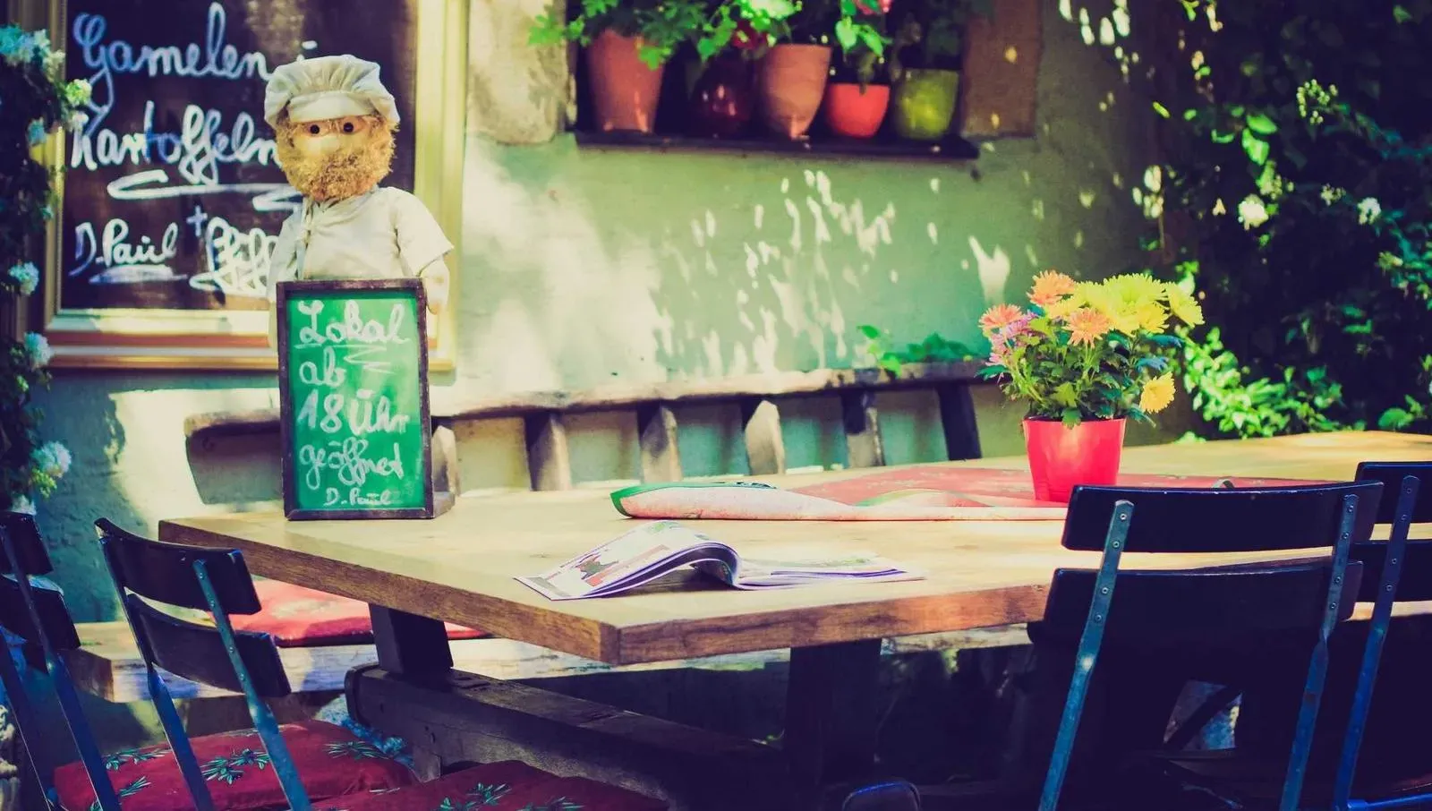 Kids engaged in playful sword fighting with pool noodles at Pirate Fest.