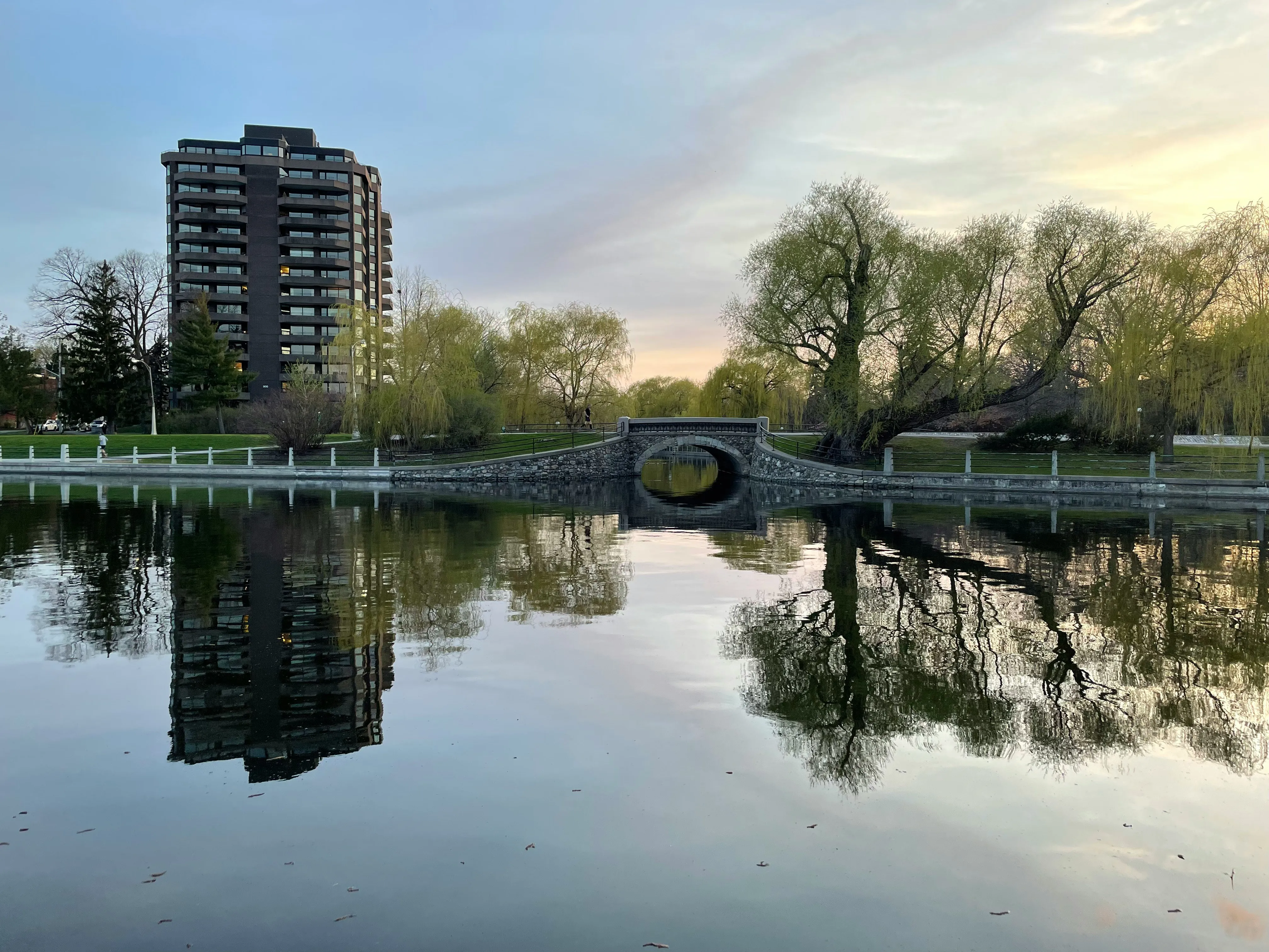 Ottawa river at sunset with bridge and treeline