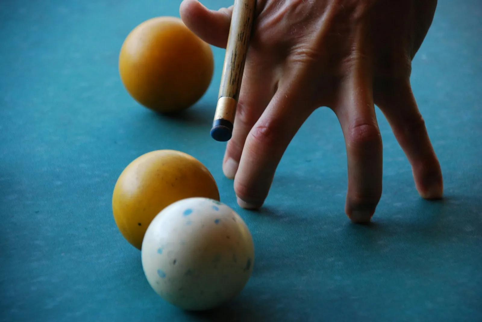 Snooker balls set up on a green baize table