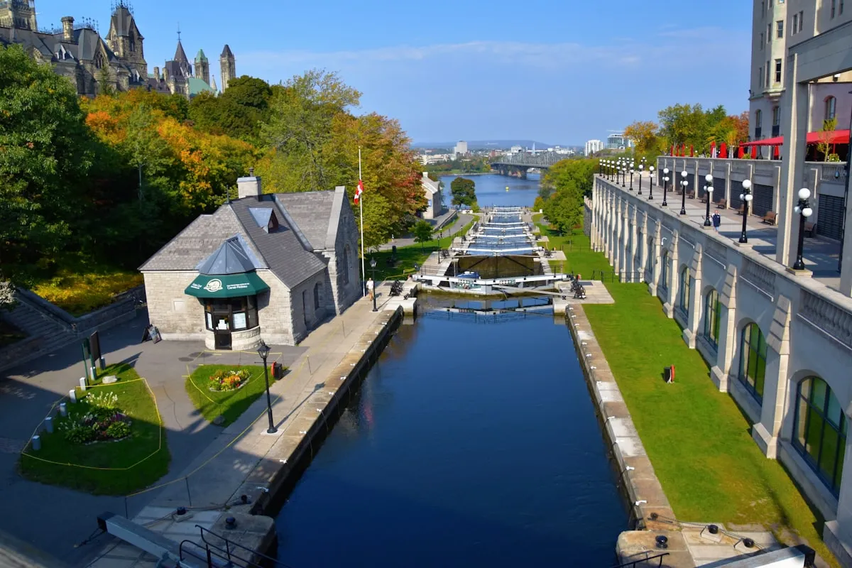 The historic Rideau Canal Locks at Sapper's Bridge with Parliament and Château Laurier in the background
