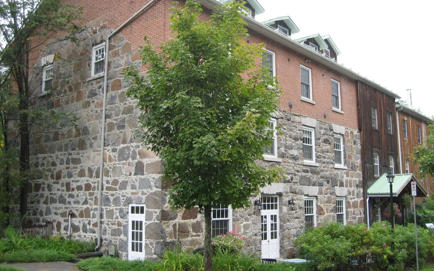 Wakefield Mill stone building and riverside hotel setting