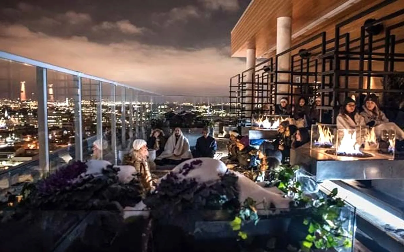 Copper Spirits and Sights rooftop seating with Ottawa skyline views at dusk