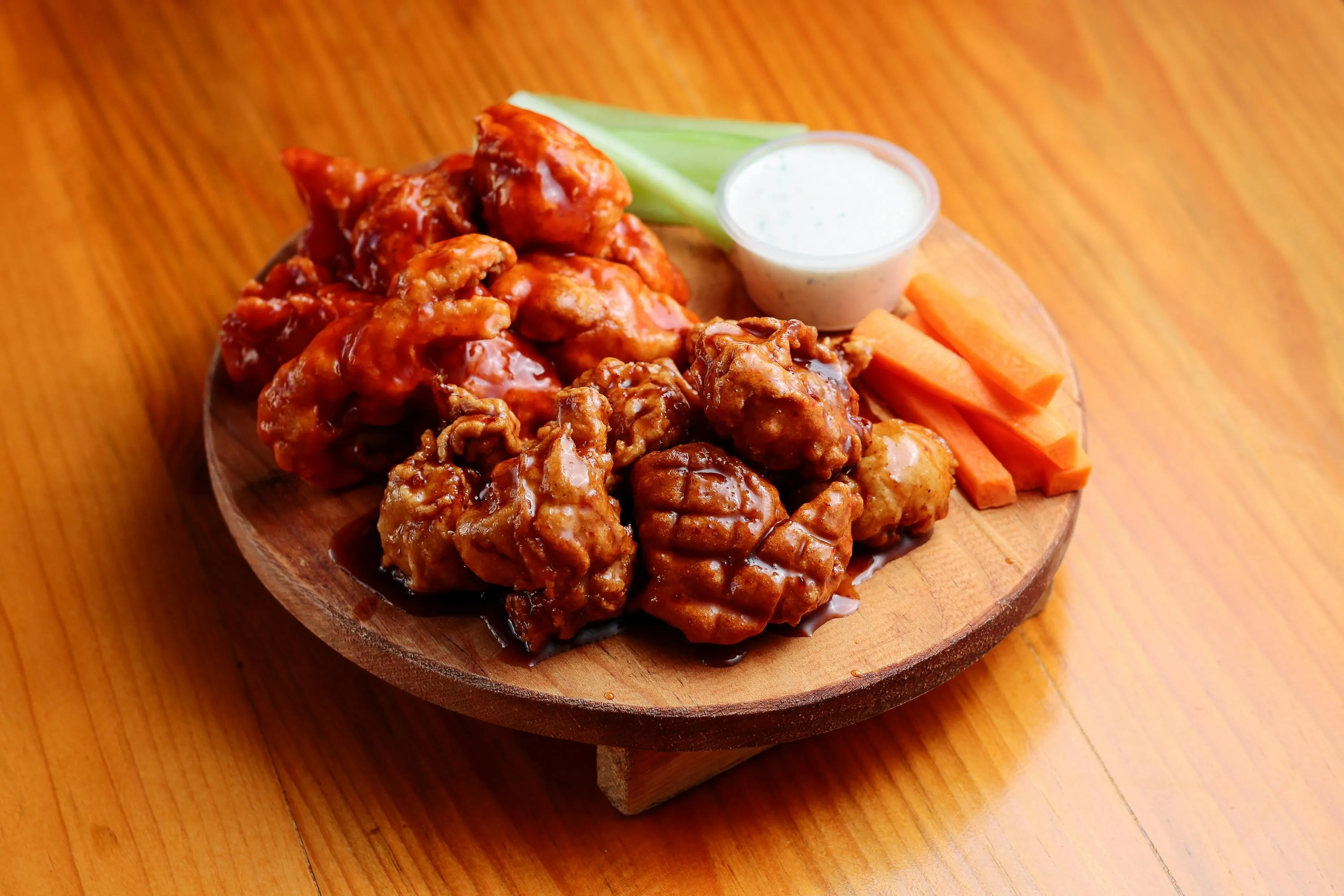 Chicken wings platter with sauces and celery