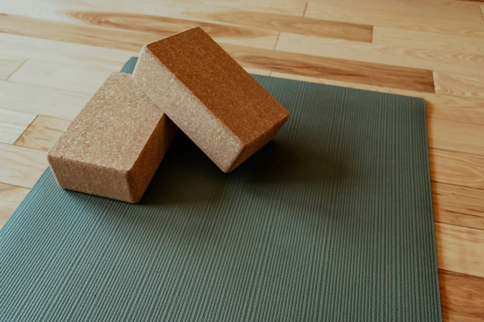 Yoga mats and blocks arranged in a bright studio