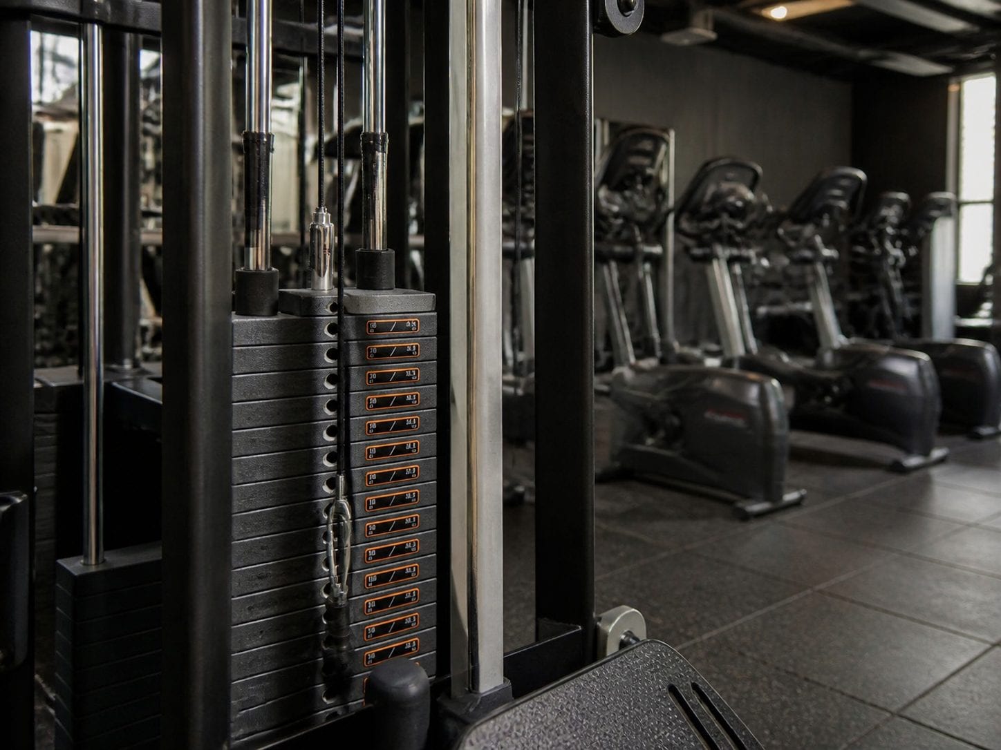 Compact 24-7 gym floor with cardio and strength stations