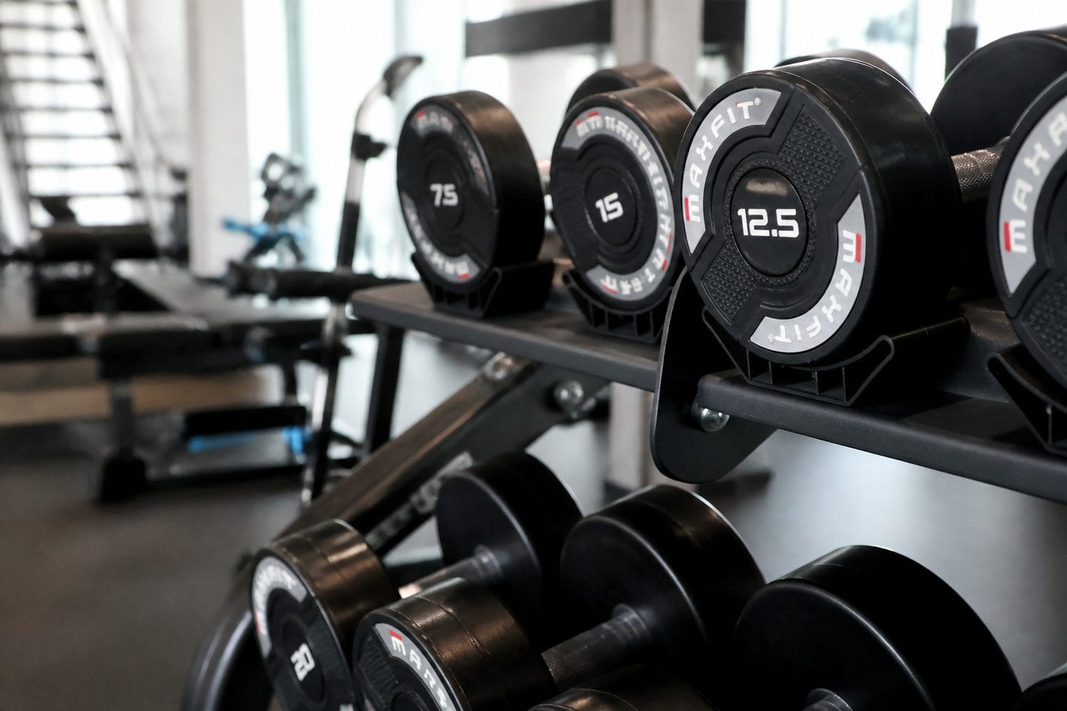 Strength and cardio equipment in a smaller-format gym setting
