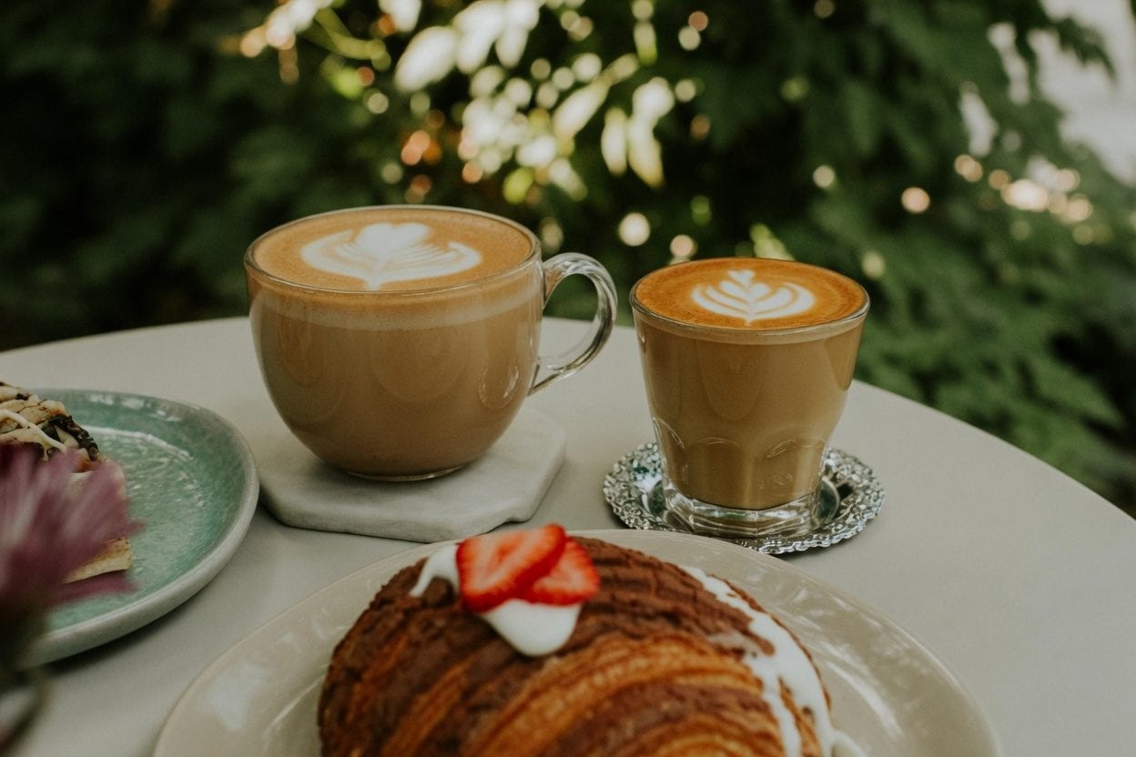 Cafe table with bagels and coffee
