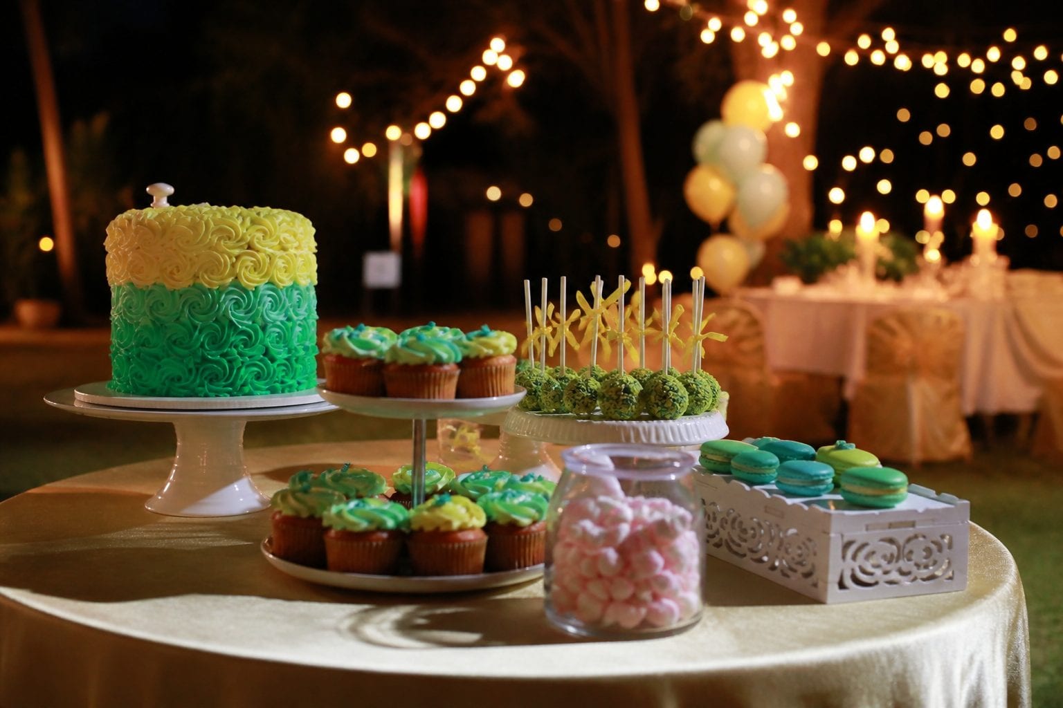 Decorated cupcakes and celebration cakes display