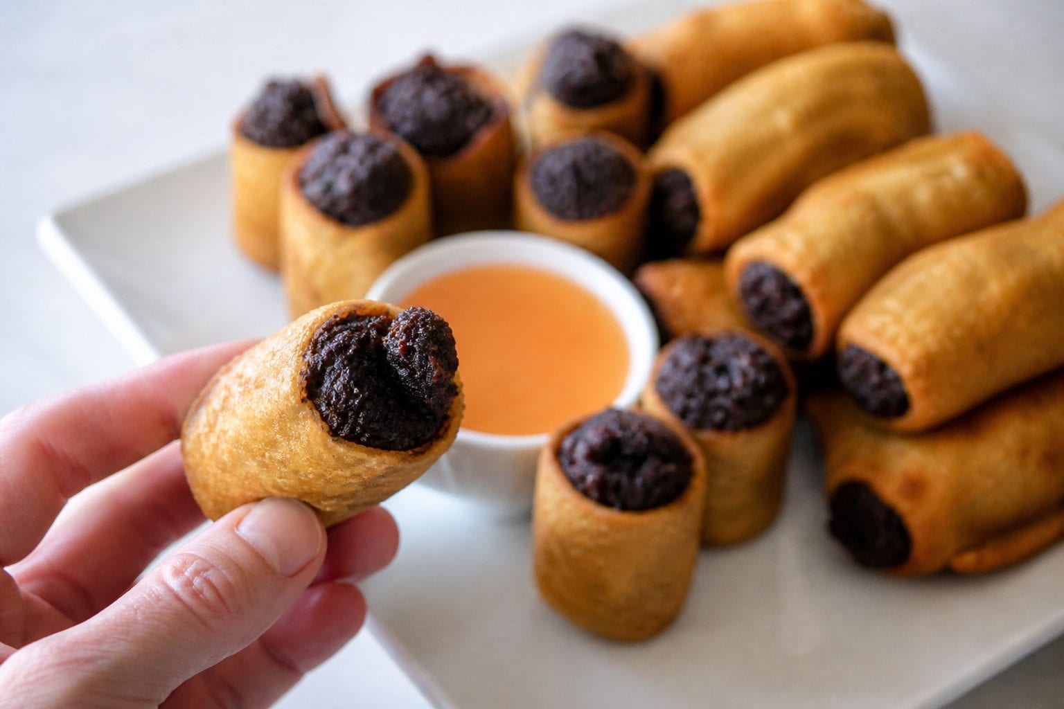 Golden Palace egg rolls arranged around dipping sauce for a classic Ottawa Chinese restaurant order