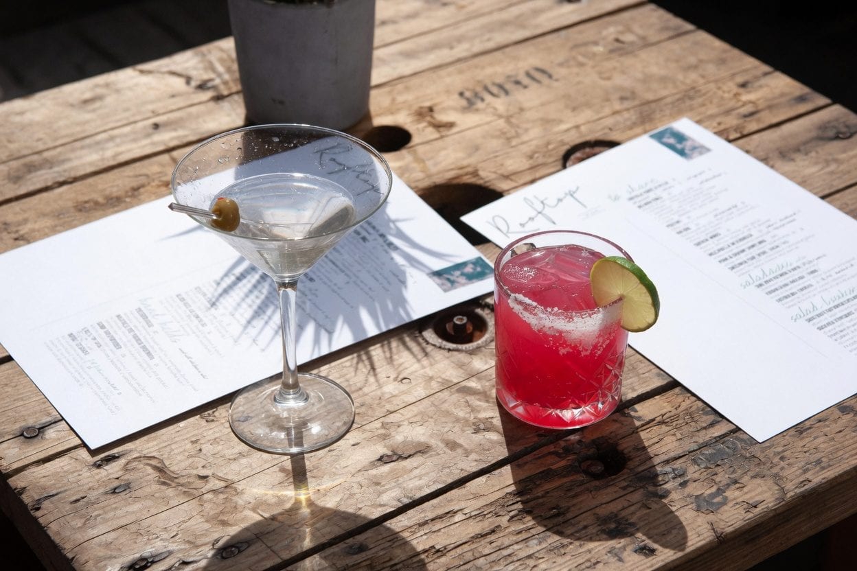 Rooftop Ottawa table with cocktails and menus, matching reservation and planning tips
