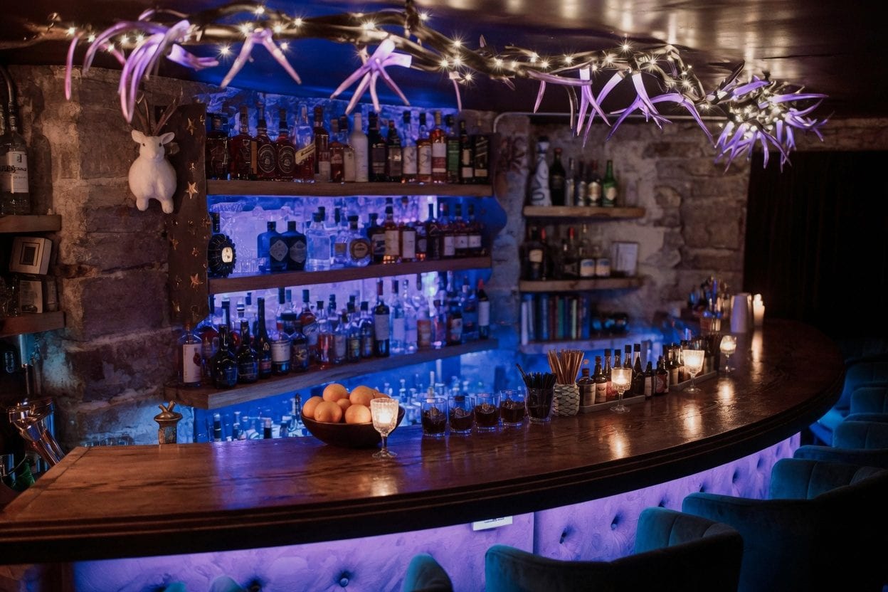 Rabbit Hole and Sneaki Tiki cocktail bar interior with colourful lighting for Sparks Street drinks