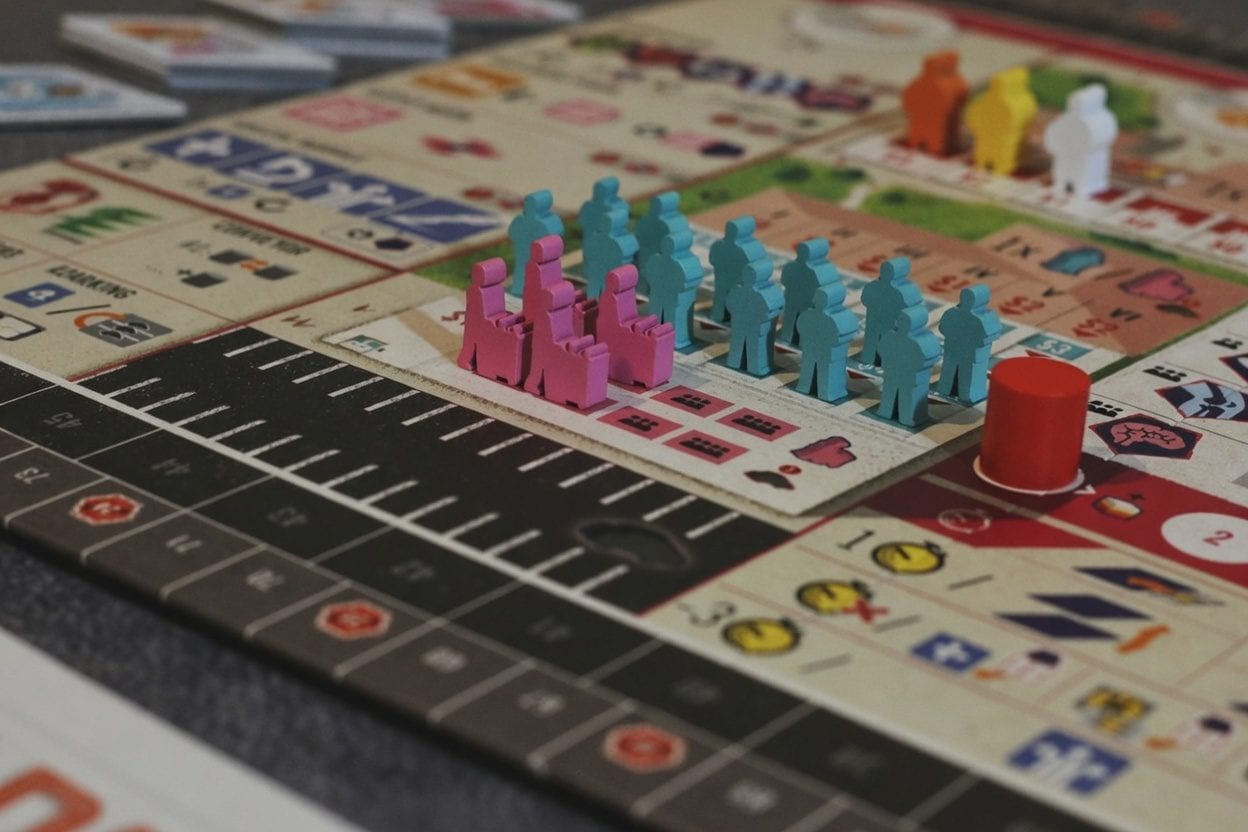 Colourful board game pieces on a table