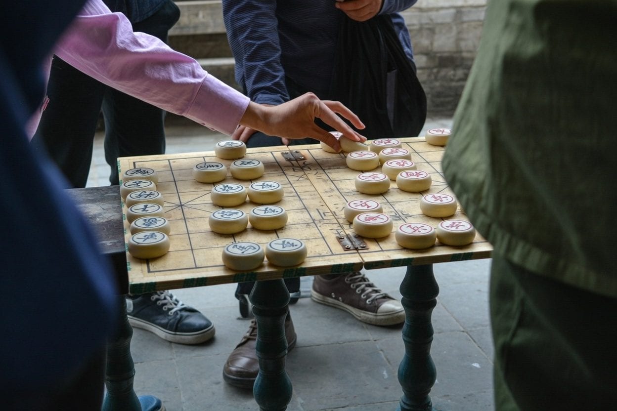 Friends playing a board game at a table
