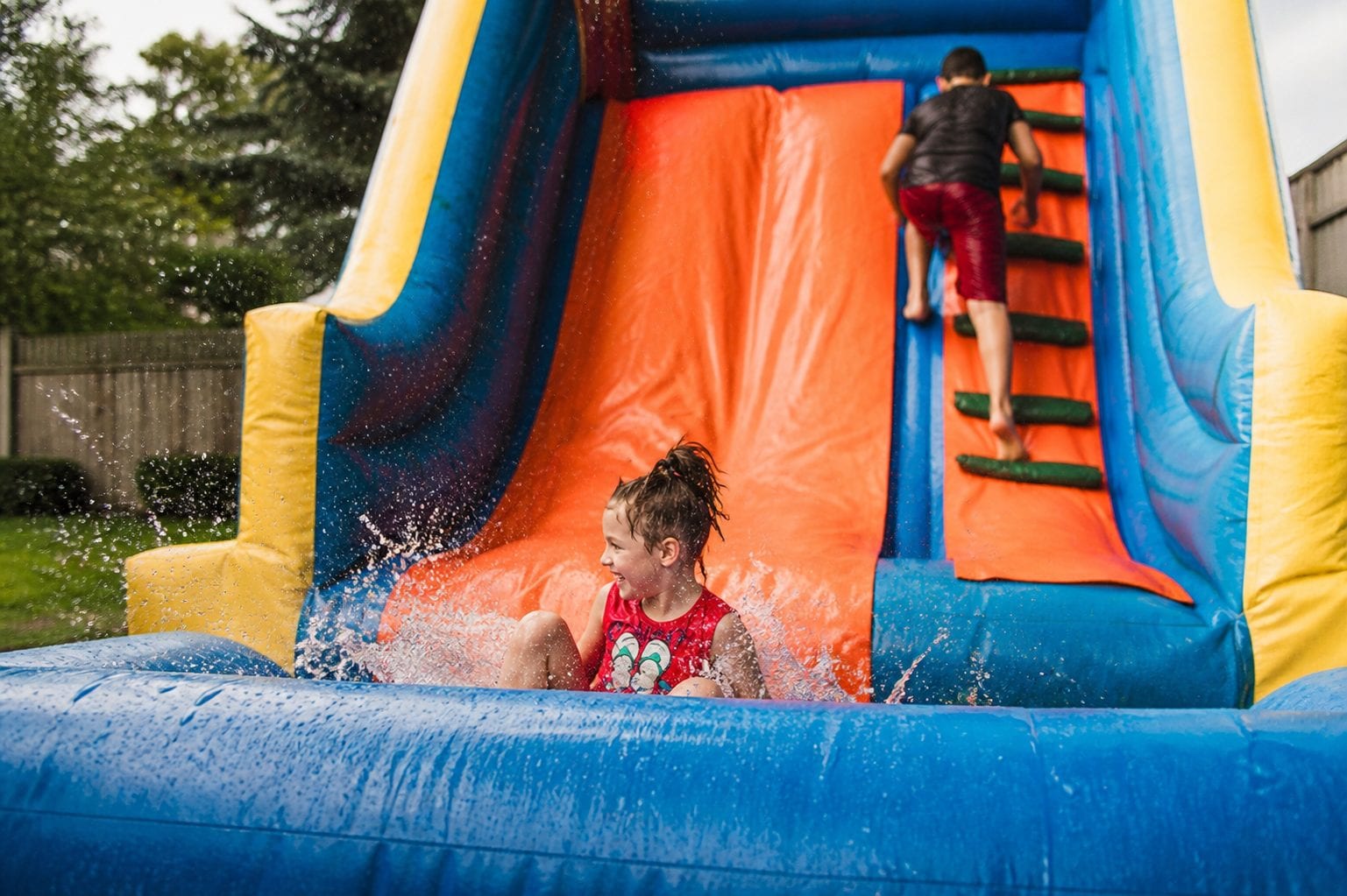 Child playing inside a bouncy castle