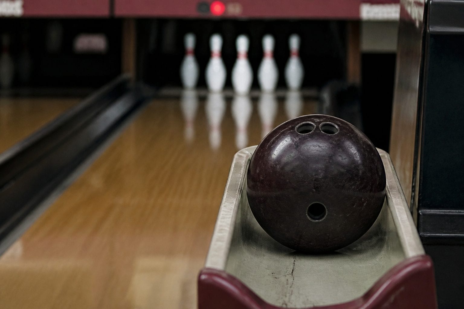 Five-pin bowling setup showing the distinctive Canadian bowling style
