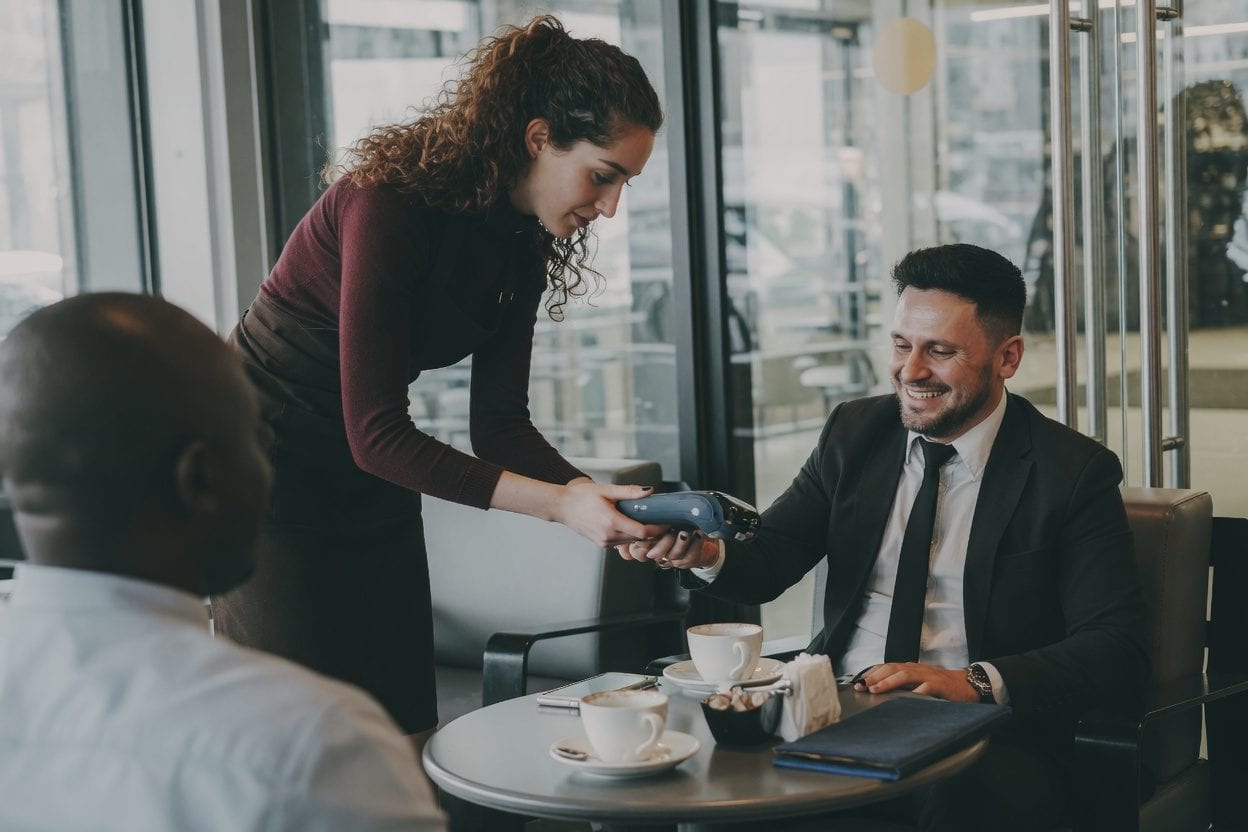 Credit card and restaurant bill on table