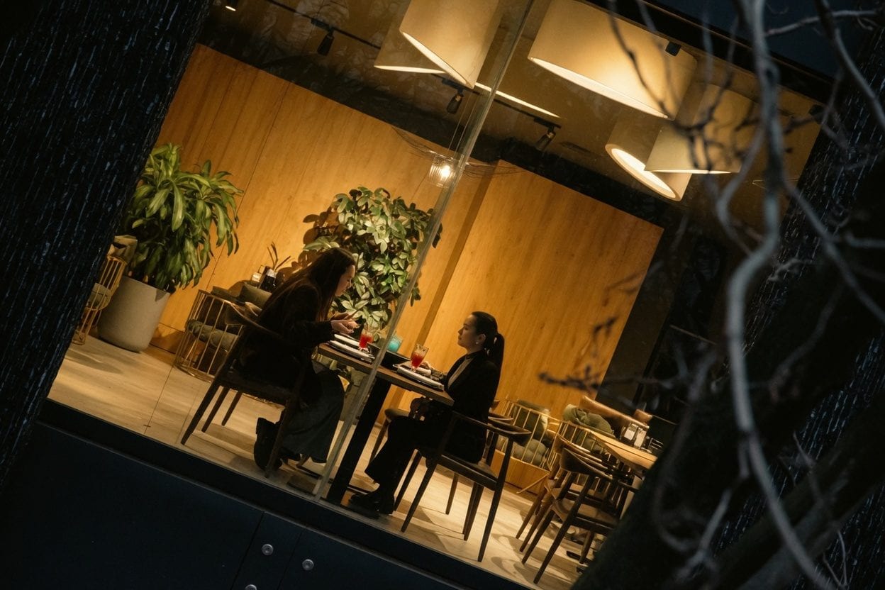 Diners enjoying meal at upscale restaurant