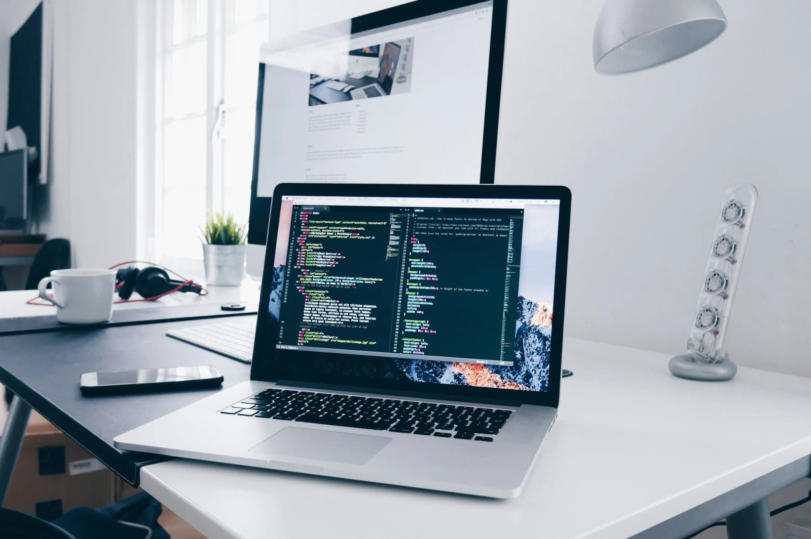 Professional web developer working on computer code.