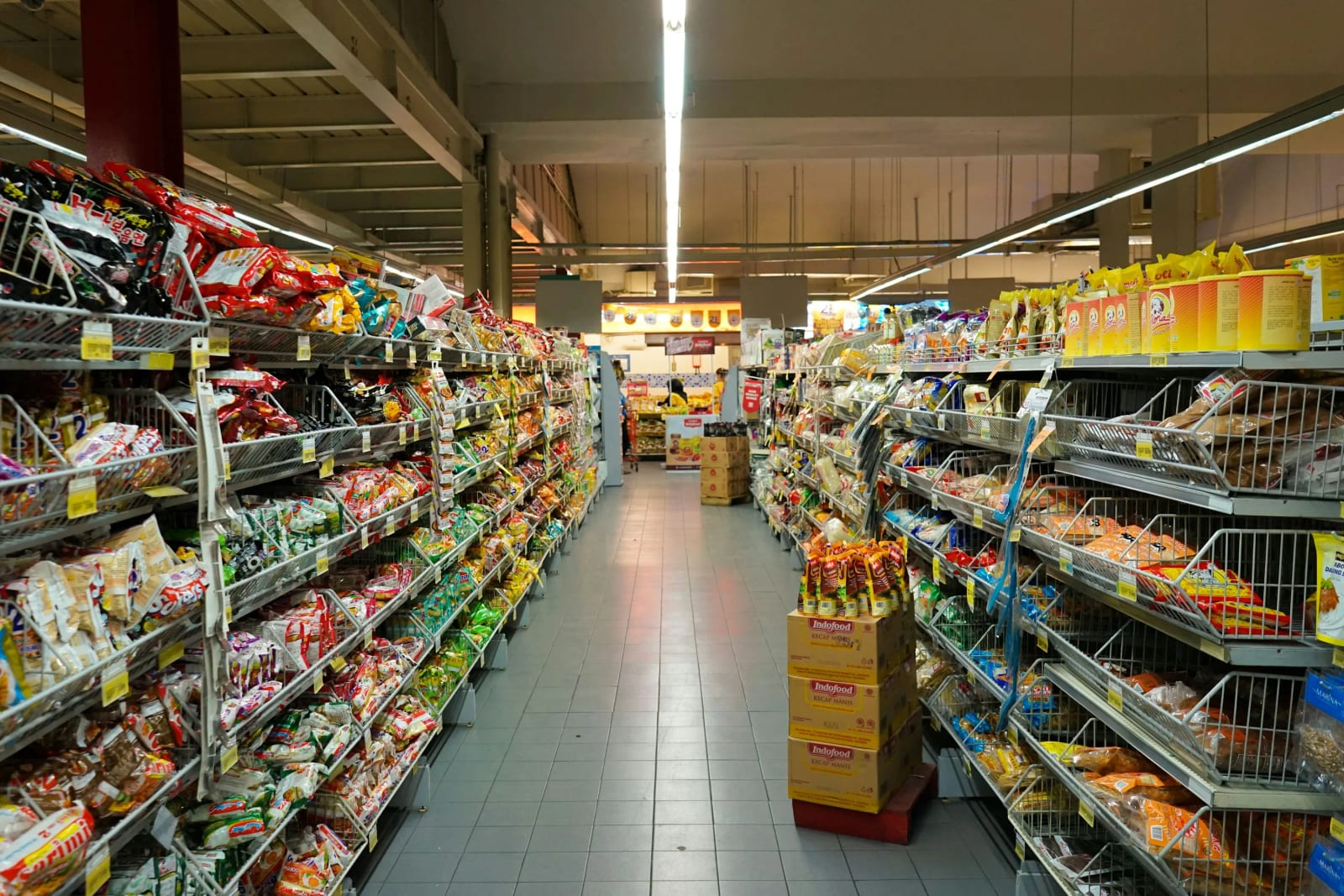 Grocery store shelves with dairy products and yogurt.
