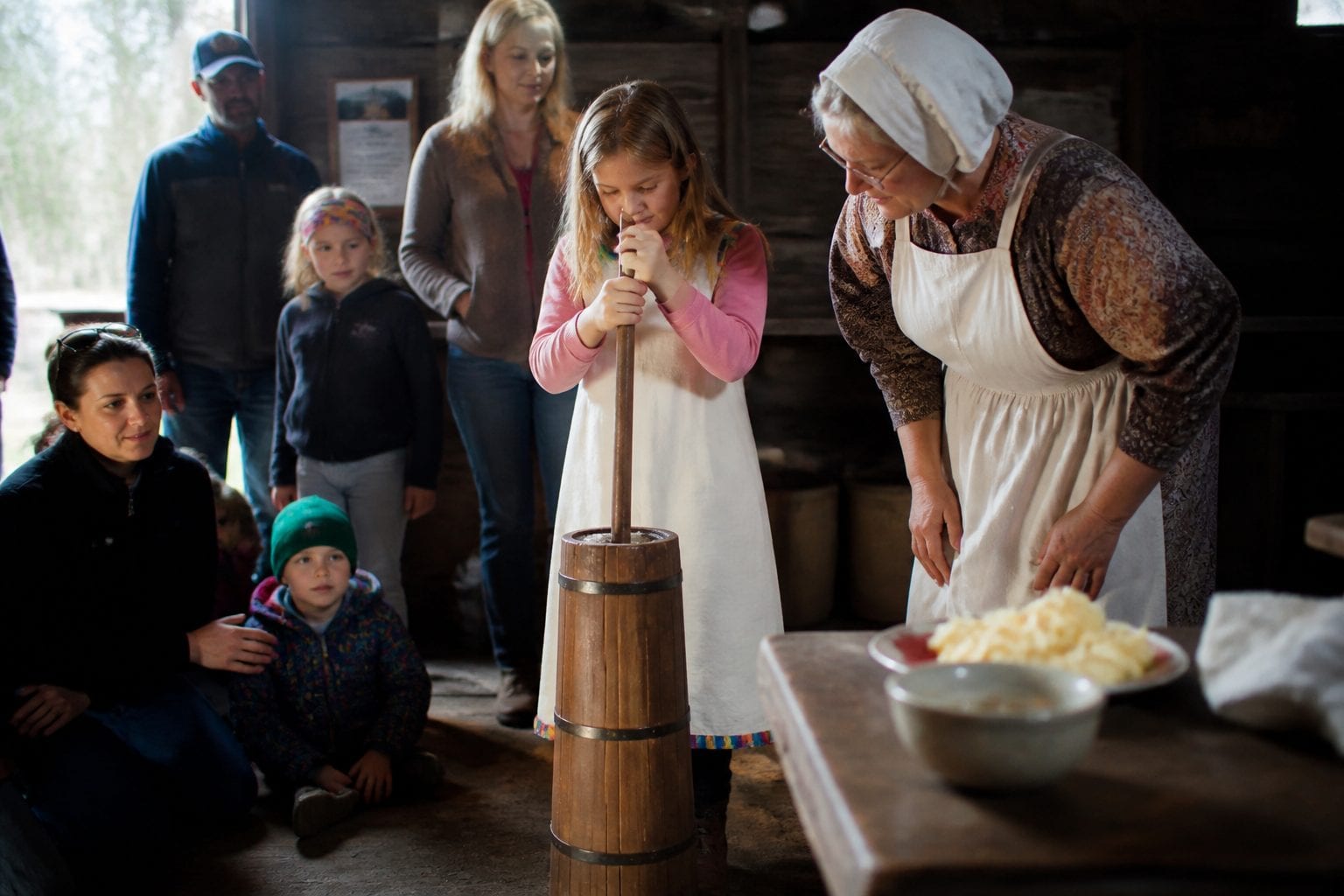 Butter churning demonstration at Cumberland Heritage Village