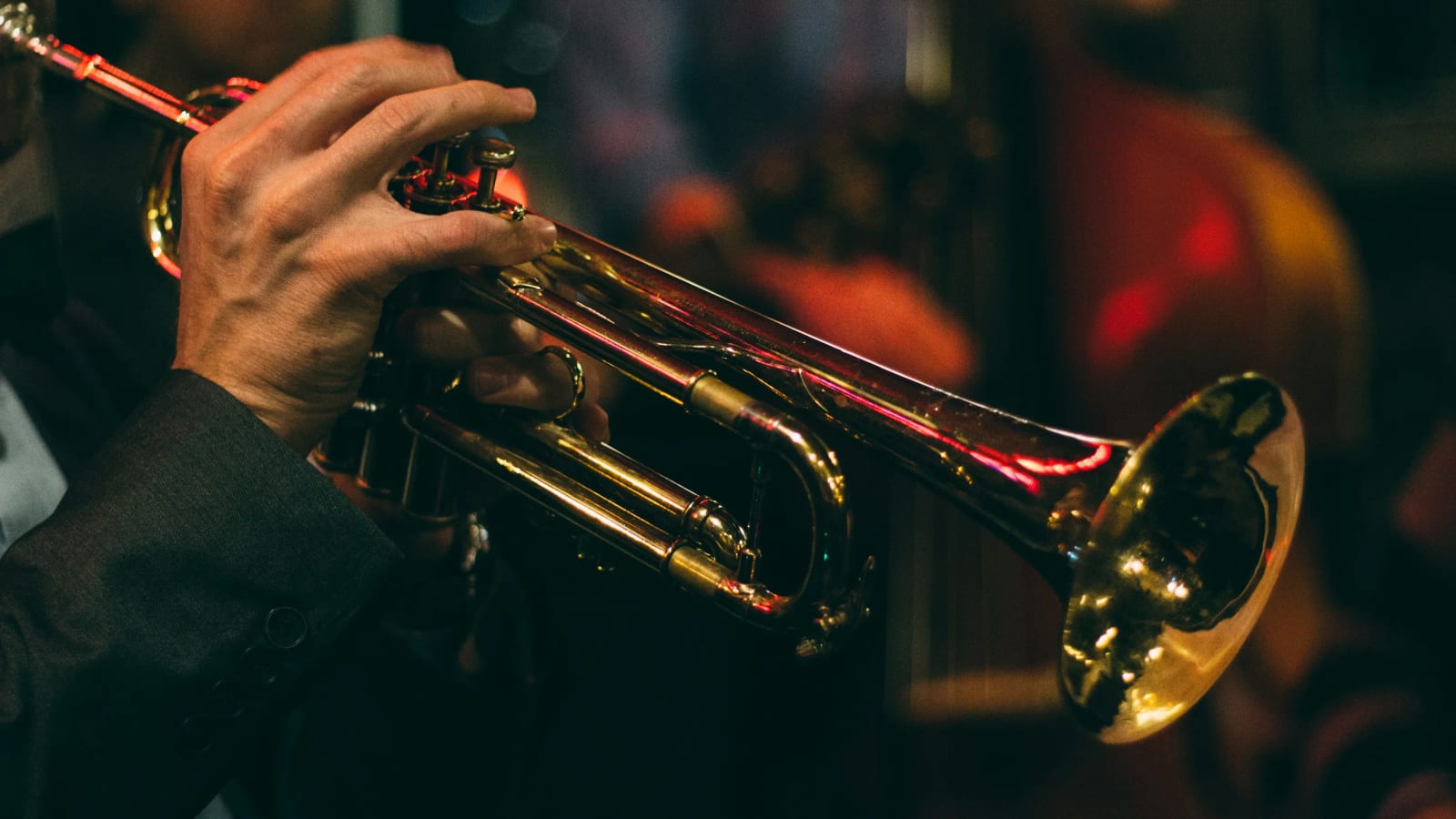 Jazz musician performing on stage with saxophone.