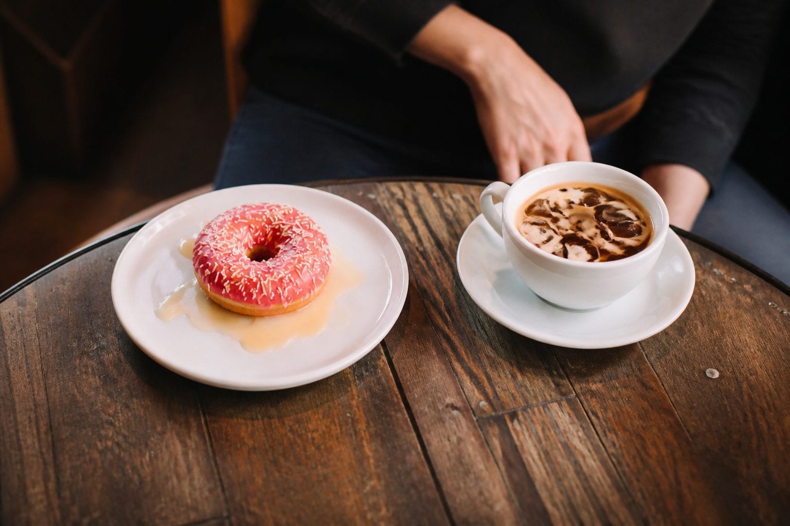 Donuts and coffee on a cafe table