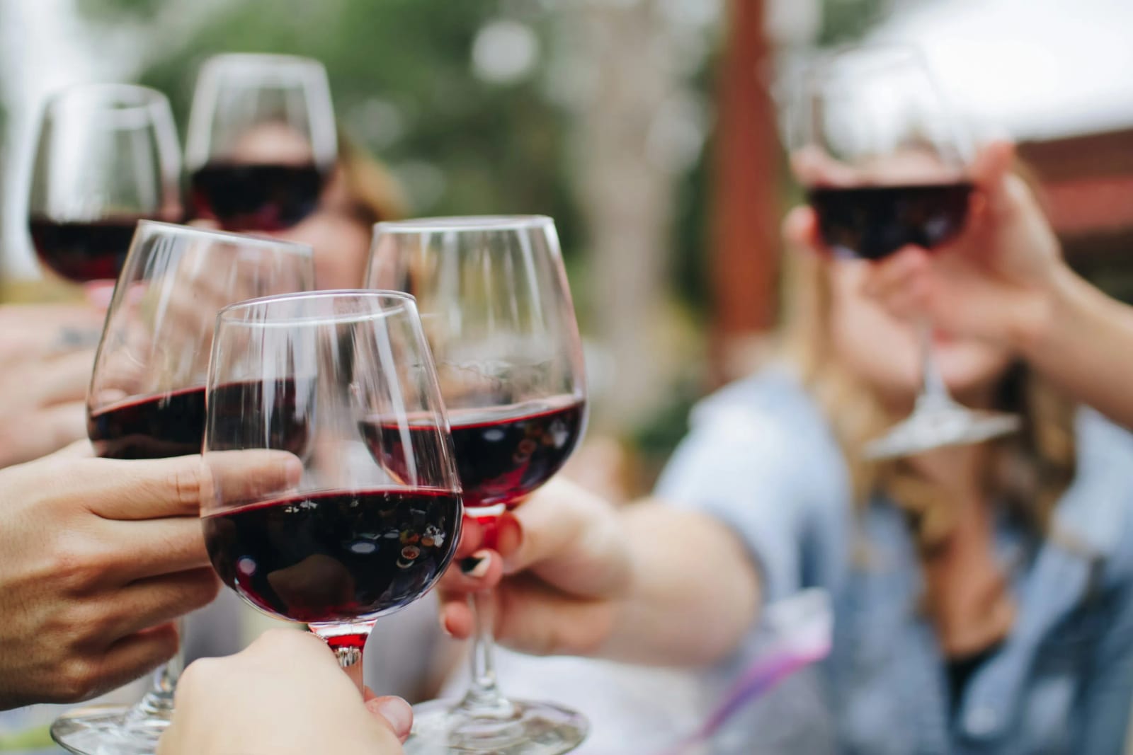 Gourmet dishes and wine glasses at food festival.
