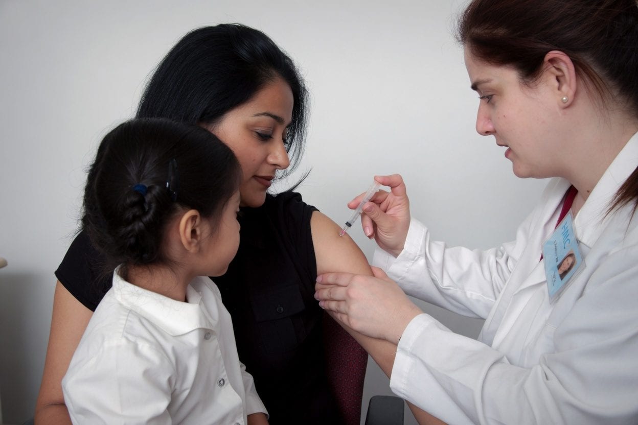 Medical professional preparing vaccination