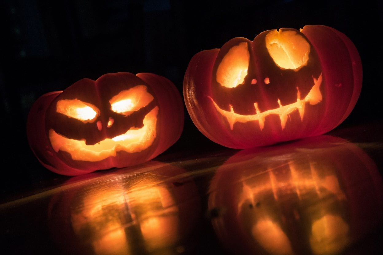 Children at Halloween festival with decorated pumpkins