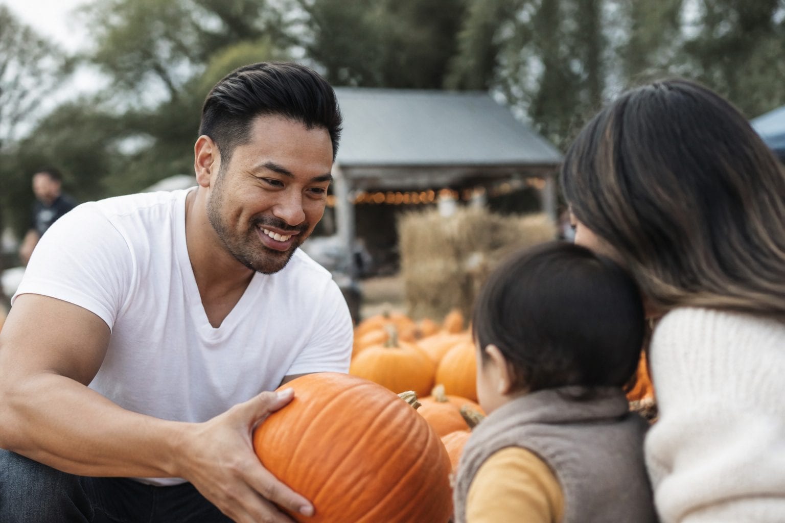 Family picking pumpkins at Ottawa farm