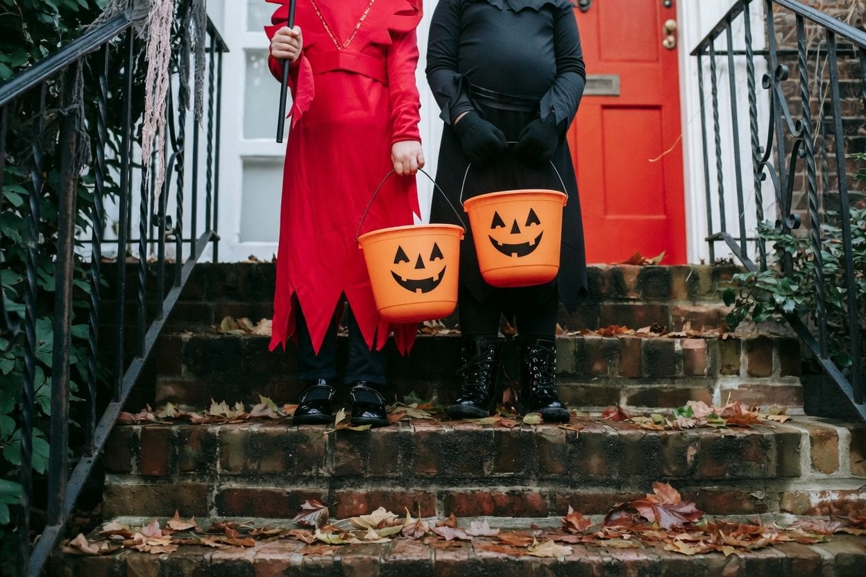 Children in costumes trick-or-treating in Ottawa neighborhood