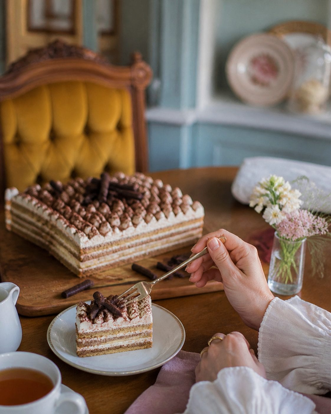 Whimsical tea room with vintage furniture and pastel colours