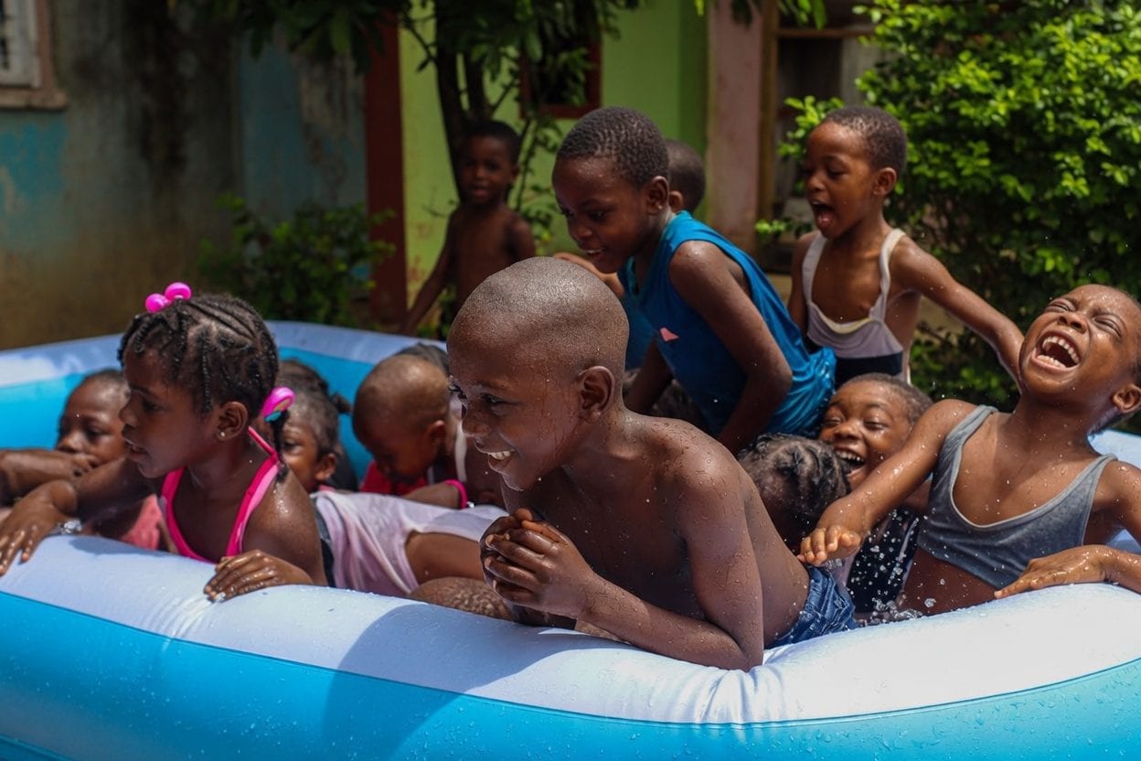 Kids splashing in a pool during a birthday party