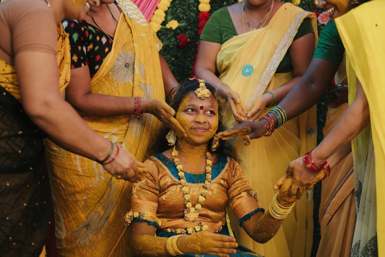 Tamil Pongal celebration with kolam and traditional cooking
