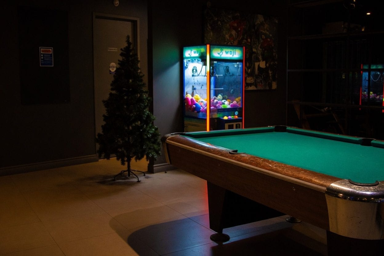 Indoor glow-in-the-dark mini golf with neon obstacles