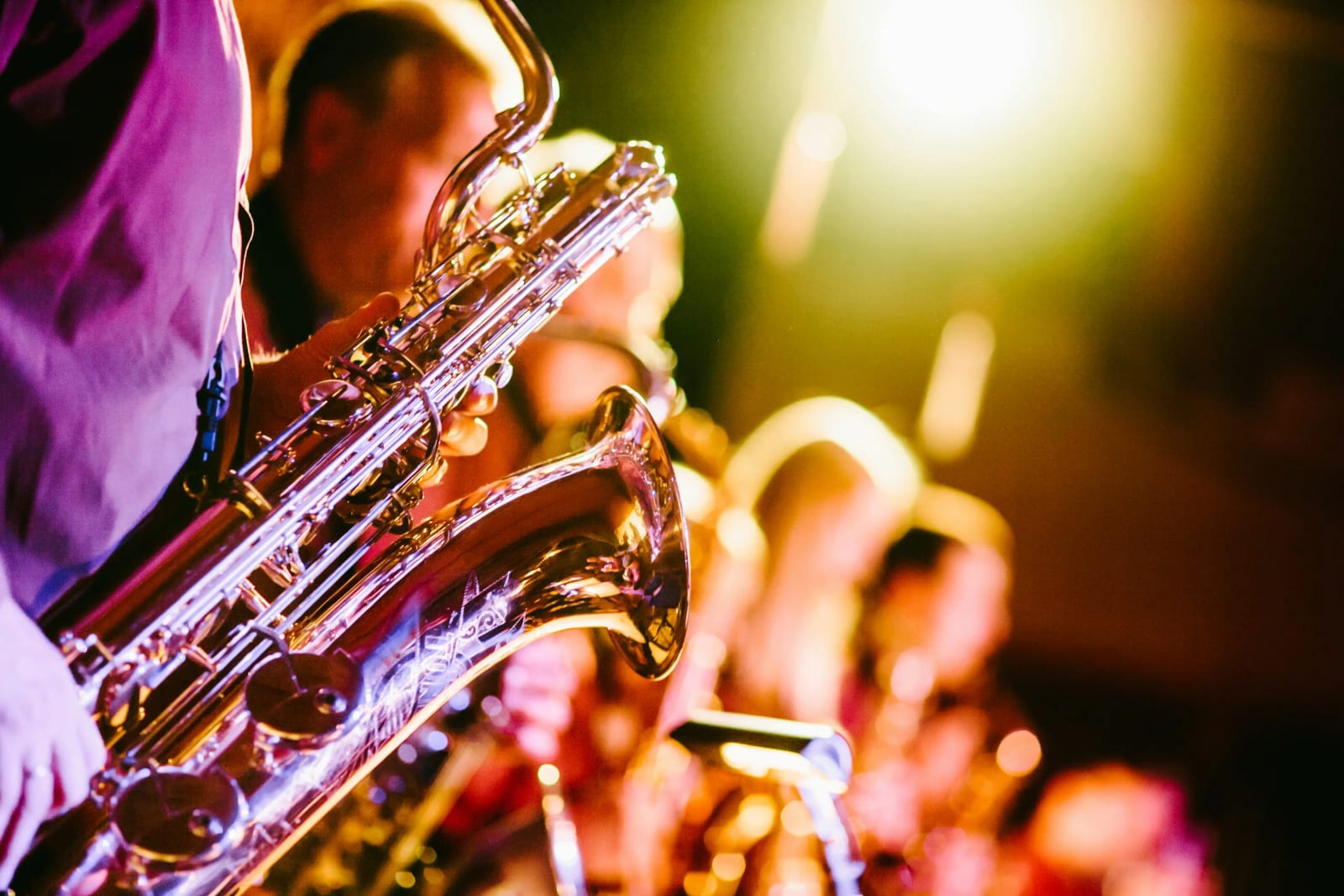 Jazz musicians performing with traditional instruments on stage.